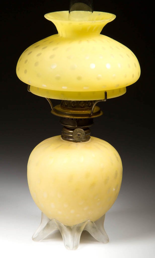 VERY RARE RAINDROP AIR-TRAP MOTHER-OF-PEARL SATIN: VERY RARE RAINDROP AIR-TRAP MOTHER-OF-PEARL SATIN MINIATURE OIL LAMP, cased yellow, with matching umbrella shade. Base has five colorless frosted applied feet. Period burner marked "E. M. & Co.", trip