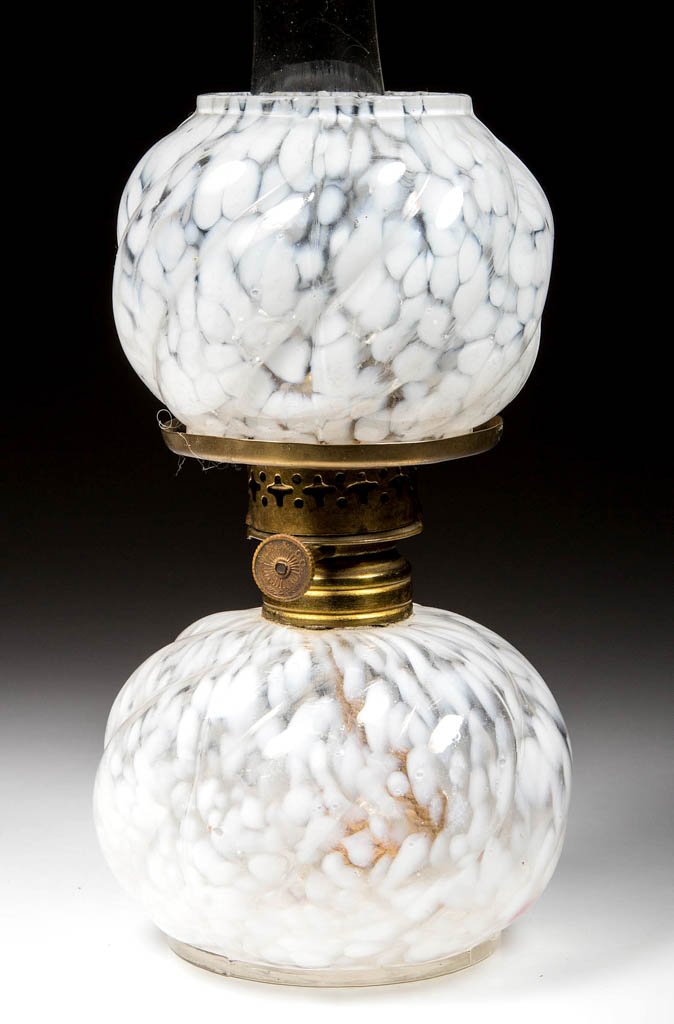 RARE EMBOSSED SWIRL MINIATURE OIL LAMP: RARE EMBOSSED SWIRL MINIATURE OIL LAMP, white opalescent spatter, with matching ball shade. Period burner marked "E. M. & Co." and chimney. Northwood Glass Co. Late 19th/early 20th century. 6 5/16" H