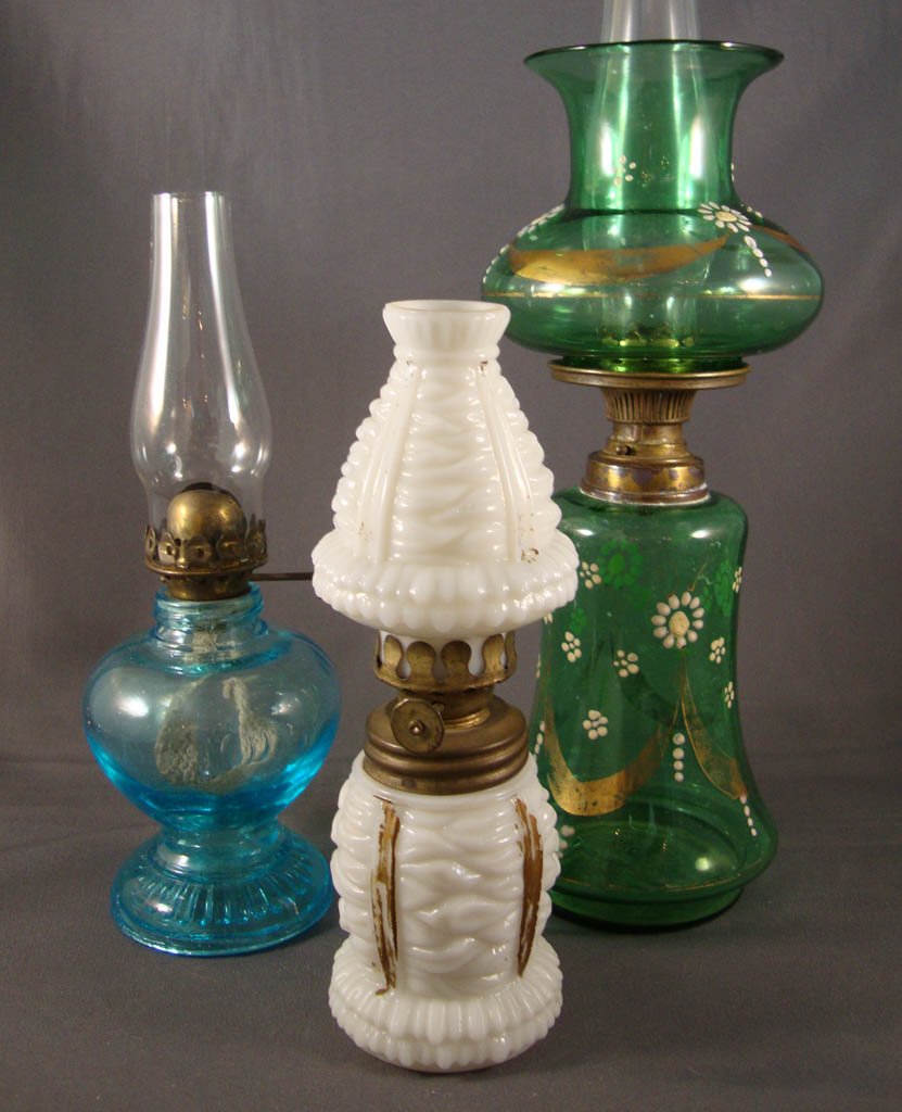 ASSORTED PATTERN MINIATURE OIL LAMPS, LOT OF THREE: ASSORTED PATTERN MINIATURE OIL LAMPS, LOT OF THREE, blue, green and opaque white, comprising a "Christmas Tree/Shag" pattern example with matching chimney-shade; a "Handy"; and an example with floral 