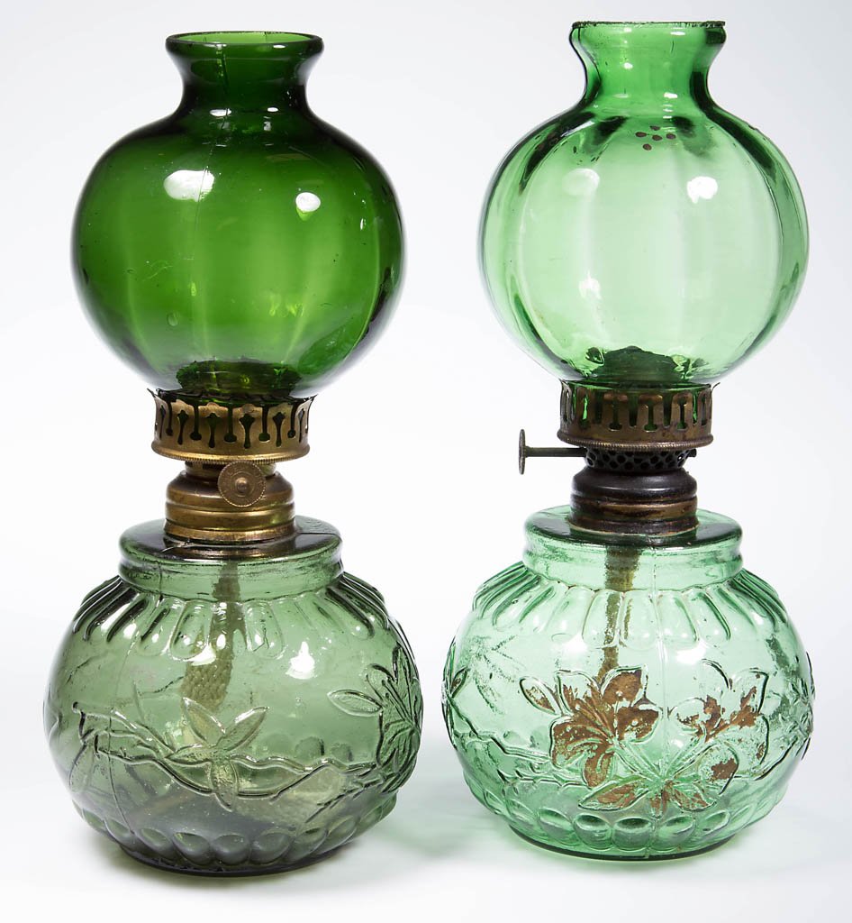 MOLDED COLORED GLASS MINIATURE LAMPS, LOT OF TWO: MOLDED COLORED GLASS MINIATURE LAMPS, LOT OF TWO, olive green and green with worn gilt decoration, appropriate slightly lighter green rib optic ball chimney-shade, as illustrated, font embossed with t