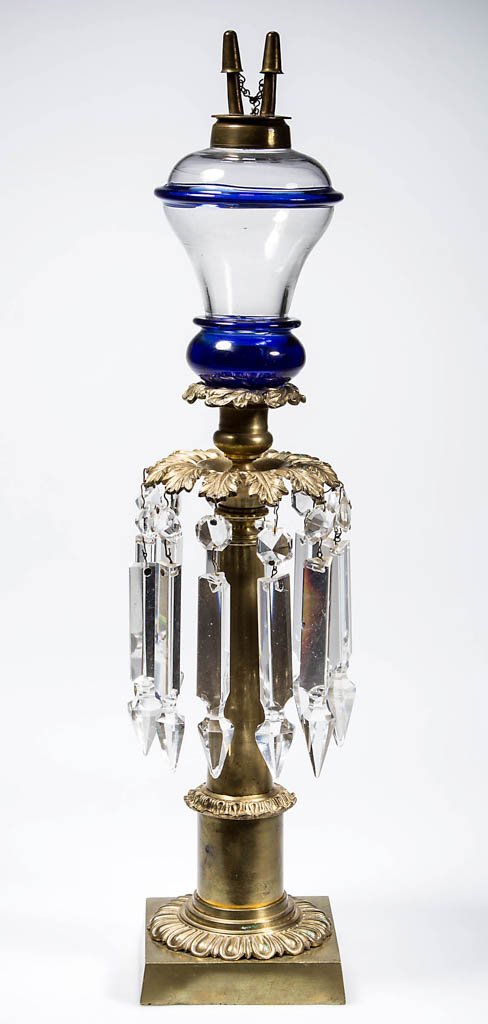 BLOWN-MOLDED FONT PEG LAMP: BLOWN-MOLDED FONT PEG LAMP, colorless pyriform font with cobalt blue shoulder ring and bulbous base, fitted in a brass candlestick base with acanthus leaf ornamentation, No. 1 fine-line collar. Fitted