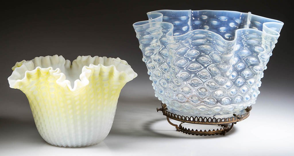 ASSORTED PATTERN LAMP SHADES, LOT OF TWO: ASSORTED PATTERN LAMP SHADES, LOT OF TWO, comprising a shaded lemon yellow air-trap mother-of-pearl satin glass example with ribbed pattern, ruffled and crimped top; and a colorless opalescent Hobnail