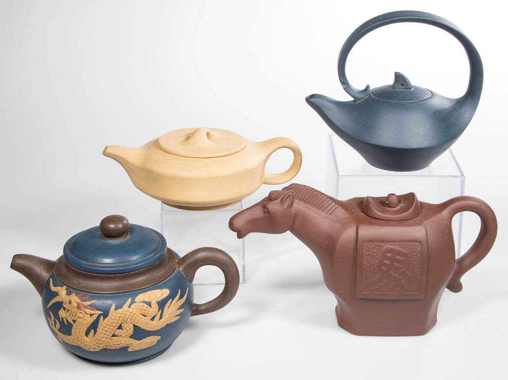 CHINESE YIXING ZISHA CLAY MINIATURE TEAPOTS, LOT OF: CHINESE YIXING ZISHA CLAY MINIATURE TEAPOTS, LOT OF FOUR, comprising a brown example, modeled as the figure of a horse, a squat globular example in blue with brown handle, spout and collar, with low-r