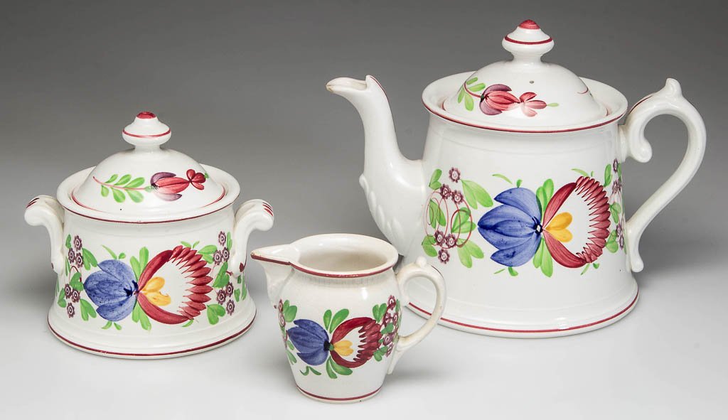 GERMAN IRONSTONE STICK SPATTER TEAWARE ARTICLES, LOT OF: GERMAN IRONSTONE STICK SPATTER TEAWARE ARTICLES, LOT OF THREE, comprising a flaring cylindrical teapot & cover, a flaring cylindrical sugar & cover and a small milk jug, each painted with bands of sty