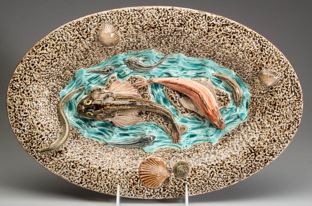 FRENCH CHOISY-LE-ROI POTTERY PALISSY-STYLE MAJOLICA: FRENCH CHOISY-LE-ROI POTTERY PALISSY-STYLE MAJOLICA DISH, oval, the deep rim molded in low relief with textured sand, with applied molded shells and eels on the rim edge, the well center with applied