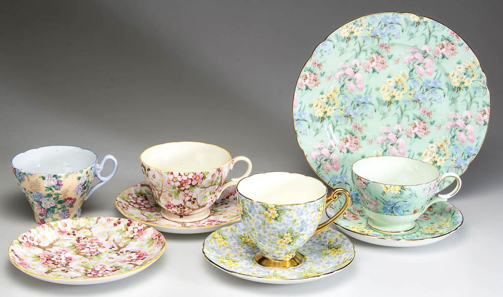 ENGLISH SHELLEY CHINA CHINTZ TEA WARE ARTICLES, LOT OF: ENGLISH SHELLEY CHINA CHINTZ TEA WARE ARTICLES, LOT OF NINE, comprising a "Henley" shape cup and saucer and a plate in the "Melody" pattern, and a variety of other chintz-printed cups and saucers. Var