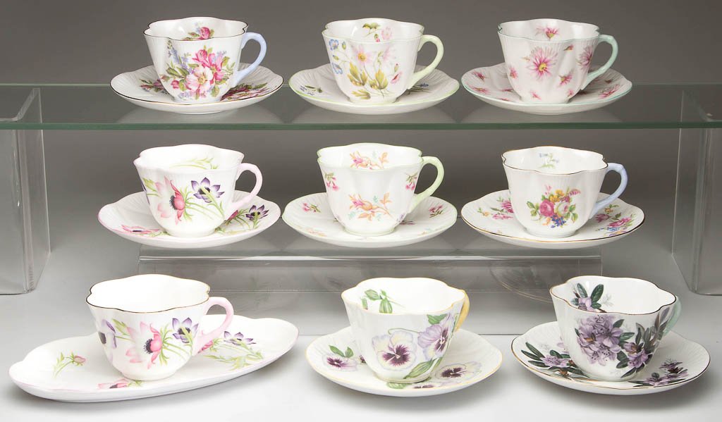 ENGLISH SHELLEY CHINA "DAINTY" SHAPE CUP AND SAUCER: ENGLISH SHELLEY CHINA "DAINTY" SHAPE CUP AND SAUCER SETS, LOT OF 8, white, with printed polychrome decoration, assorted patterns, including "Baileys Azalea", "Anemone", and "Wild Anemone" examples, al