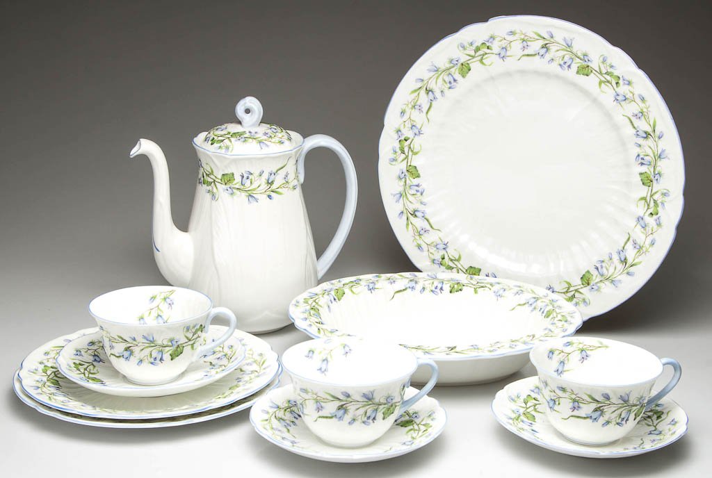 ENGLISH SHELLEY CHINA "DAINTY" SHAPE "HAREBELL" PATTERN: ENGLISH SHELLEY CHINA "DAINTY" SHAPE "HAREBELL" PATTERN TABLE ARTICLES, LOT OF 11, white, printed with blue flowers on green stems, comprising a coffee pot and cover, an oval bowl, a dinner plate, two