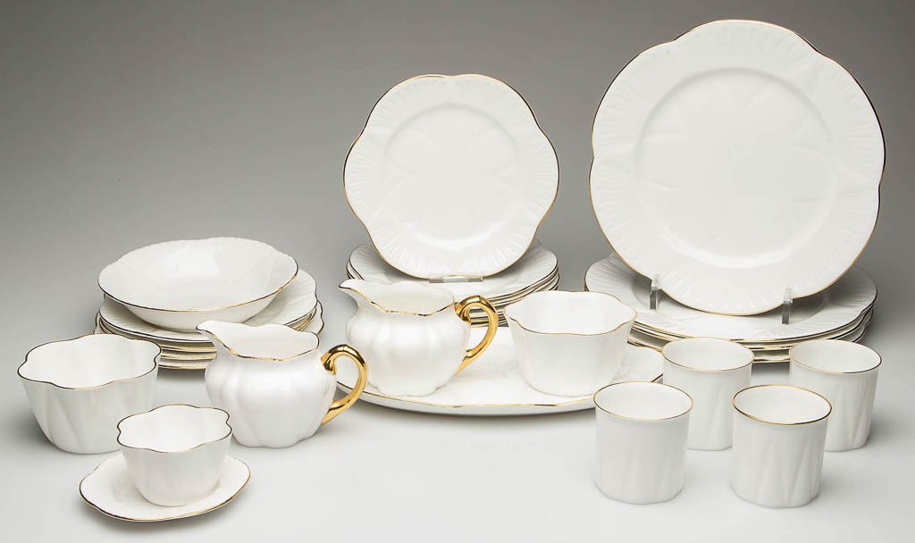 ENGLISH SHELLEY CHINA "DAINTY" SHAPE "REGENCY" PATTERN: ENGLISH SHELLEY CHINA "DAINTY" SHAPE "REGENCY" PATTERN TABLE ARTICLES, LOT OF 26, white with gilt rims and handles, including a creamer and open sugar with tray, a butter/mint/sweets dish, and four to