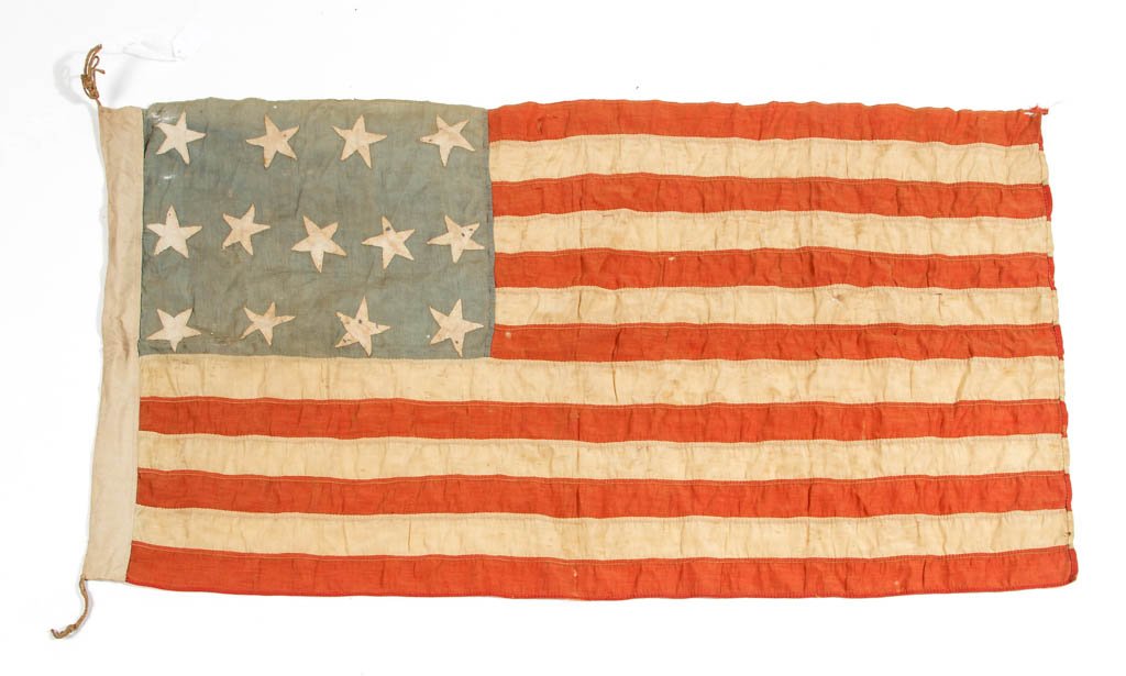 UNITED STATES 13-STAR CENTENNIAL FLAG: UNITED STATES 13-STAR CENTENNIAL FLAG, machine-stitched stripes and hand-stitched stars, stamped "PRESENTED BY / MRS. SUZANNE GRIFFITH HAMMOND / BERRYVILLE, VA" on hoist strip. Probably presented at a