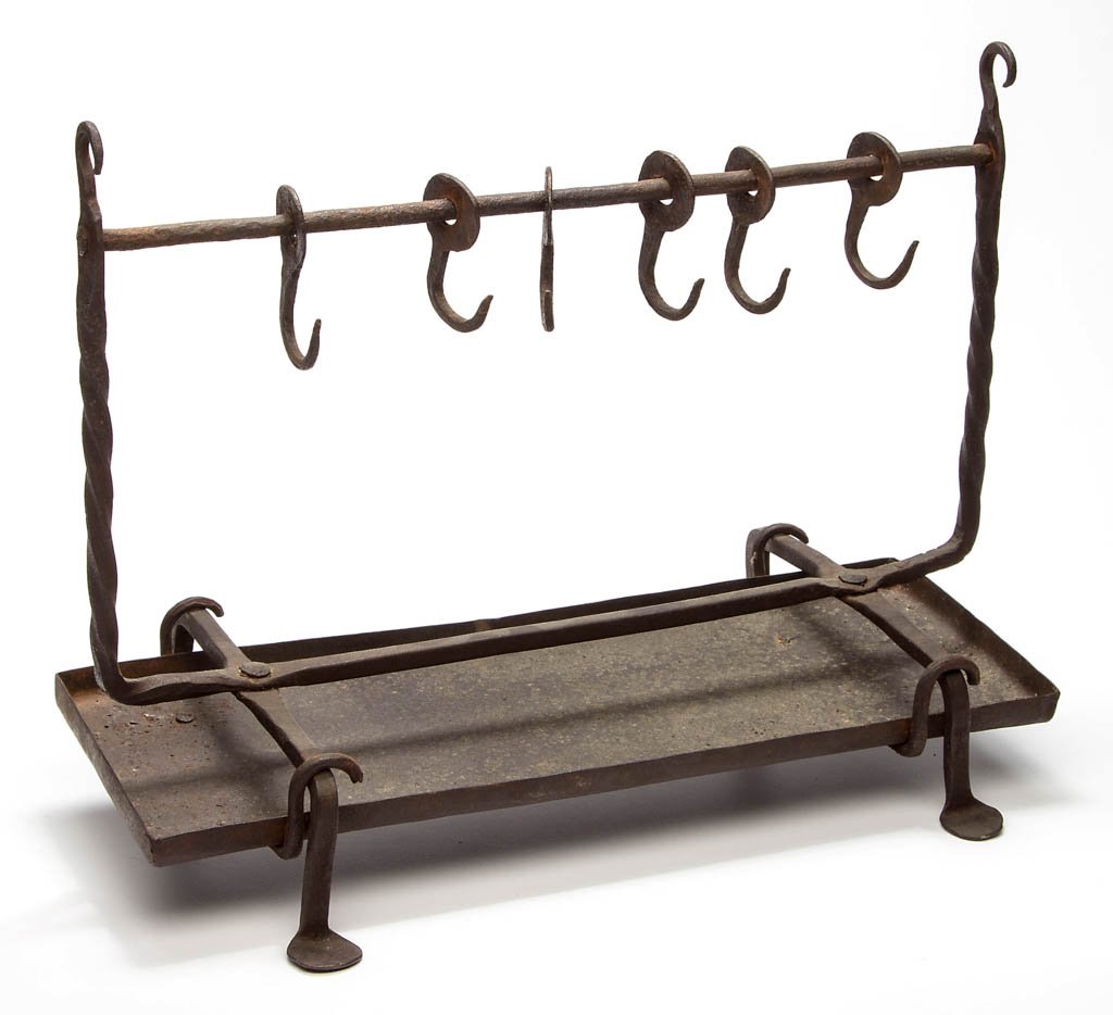WROUGHT-IRON HEARTH BIRD ROASTER / SPIT: WROUGHT-IRON HEARTH BIRD ROASTER / SPIT, rectangular form, vertical spiraling support arms terminating in a hook, horizontal hanger with six sliding hooks, supported by four legs with large penny feet