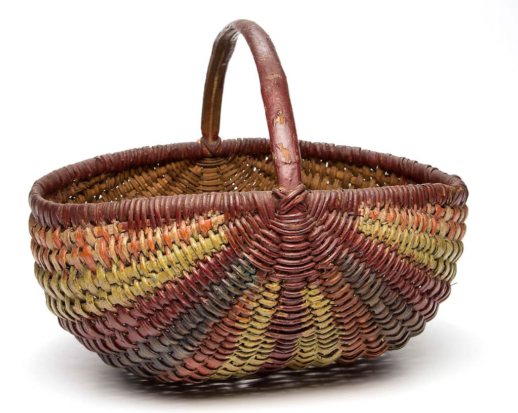 VIRGINIA, POSSIBLY WEST VIRGINIA, PAINT-DECORATED: VIRGINIA, POSSIBLY WEST VIRGINIA, PAINT-DECORATED RIB-TYPE WOVEN-SPLINT BASKET, white oak, the circular form with arched handle, tightly wrapped rim, and converging ribs. Retains old paint-decorated s