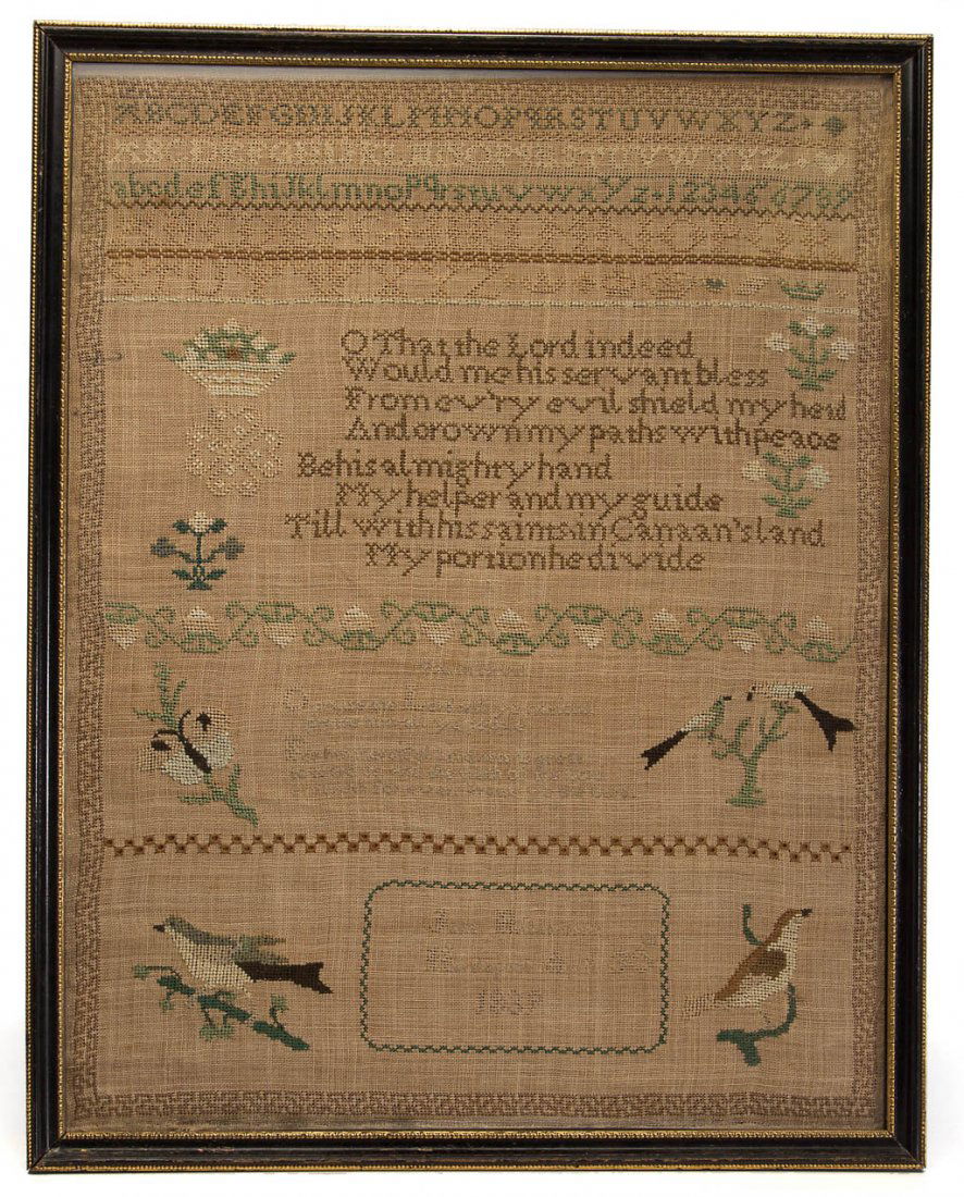 AMERICAN OR BRITISH NEEDLEWORK SAMPLER: AMERICAN OR BRITISH NEEDLEWORK SAMPLER, silk threads on a linen ground, a large example, dated 1839, featuring baskets, floral devices, and birds perched on branches. Housed under glass in modern ebon
