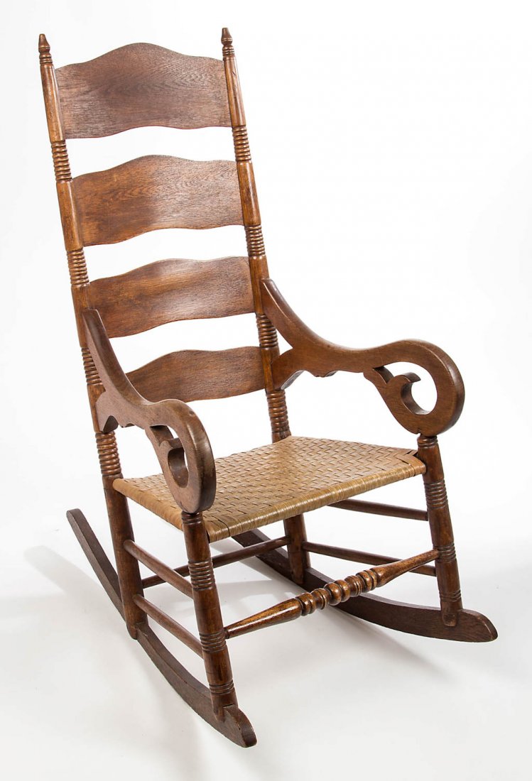LOUDOUN CO., VIRGINIA LADDER-BACK ROCKING ARMCHAIR: LOUDOUN CO., VIRGINIA LADDER-BACK ROCKING ARMCHAIR, the back with four shaped and graduated slats flanked by ring-turned rear posts topped with petite acorn-form finials and cut-out scrolled arm rests