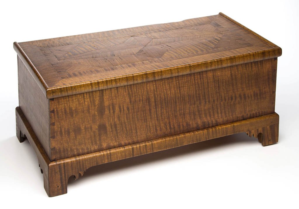 MID-ATLANTIC, POSSIBLY NORTHERN SHENANDOAH VALLEY OF: MID-ATLANTIC, POSSIBLY NORTHERN SHENANDOAH VALLEY OF VIRGINIA, FIGURED MAPLE MINIATURE BLANKET CHEST, the hinged rectangular top with parquetry-inlaid design and applied edge molding over a finely dov
