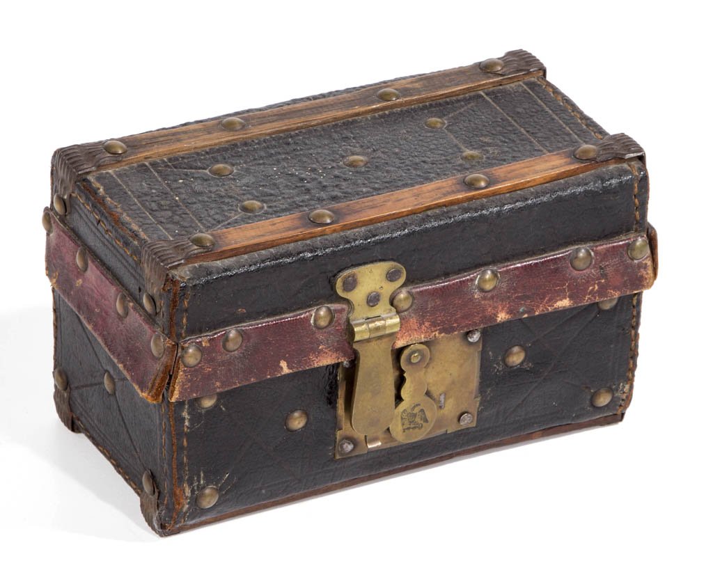 AMERICAN DIMINUTIVE LEATHER-COVERED DOCUMENT BOX: AMERICAN DIMINUTIVE LEATHER-COVERED DOCUMENT BOX, with hinged lid, tooled leather covering with decorative brass tacks, and brass lock with Federal eagle. First quarter 19th century. 4 3/4" H, 7 1/2"