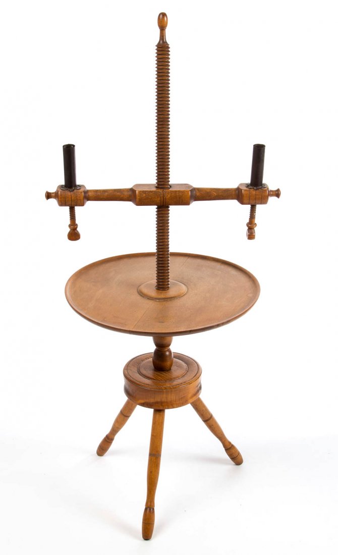 AMERICAN TURNED MAPLE ADJUSTABLE CANDLESTAND: AMERICAN TURNED MAPLE ADJUSTABLE CANDLESTAND, two-arm candleholder and a lower tray, both adjustable on the central screw shaft, raised on a tripod base. 19th or 20th century. 37" HOA, 16" W, 14 1/4" 