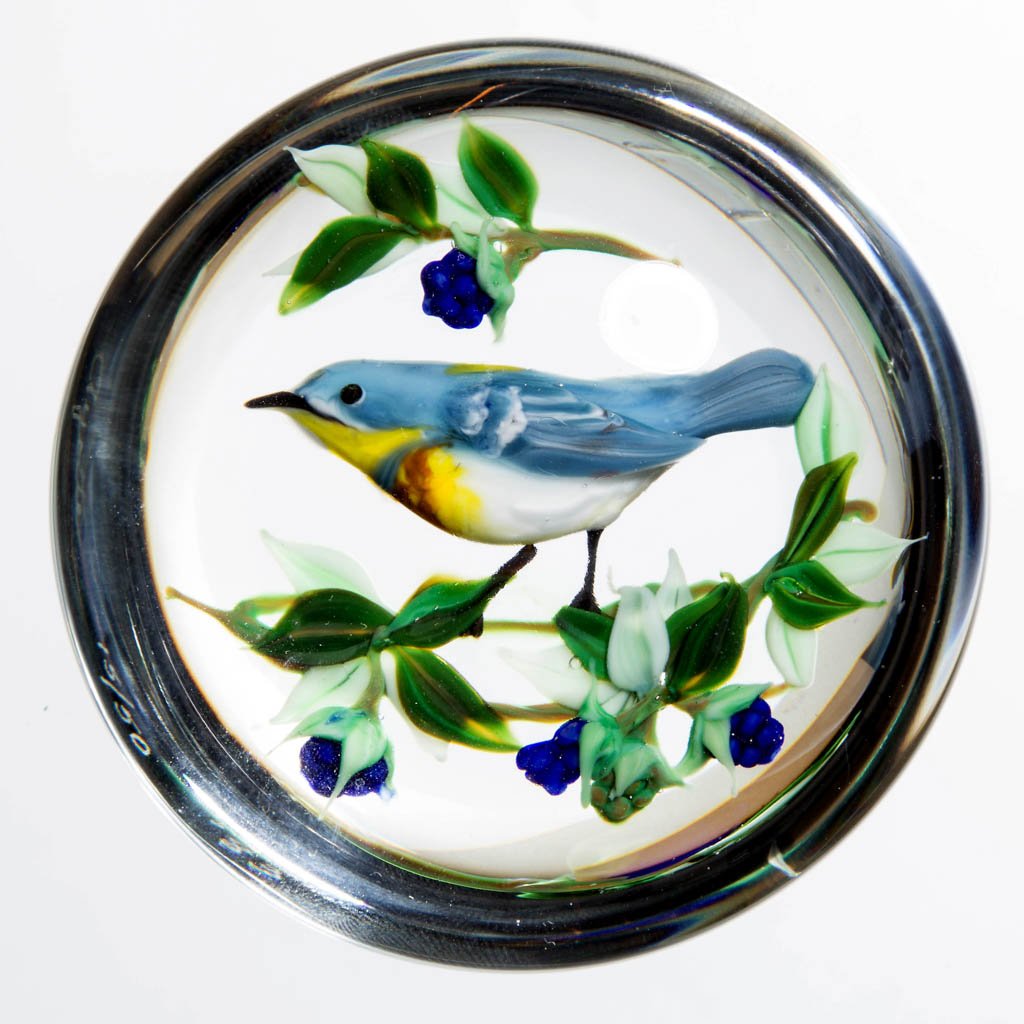 RICK AYOTTE STUDIO ART GLASS LAMPWORK PAPERWEIGHT: RICK AYOTTE STUDIO ART GLASS LAMPWORK PAPERWEIGHT, depicting a blue bird, signed "Ayotte/15-50/'83." 1983. 3 1/4" D. Provenance: From a private collection.