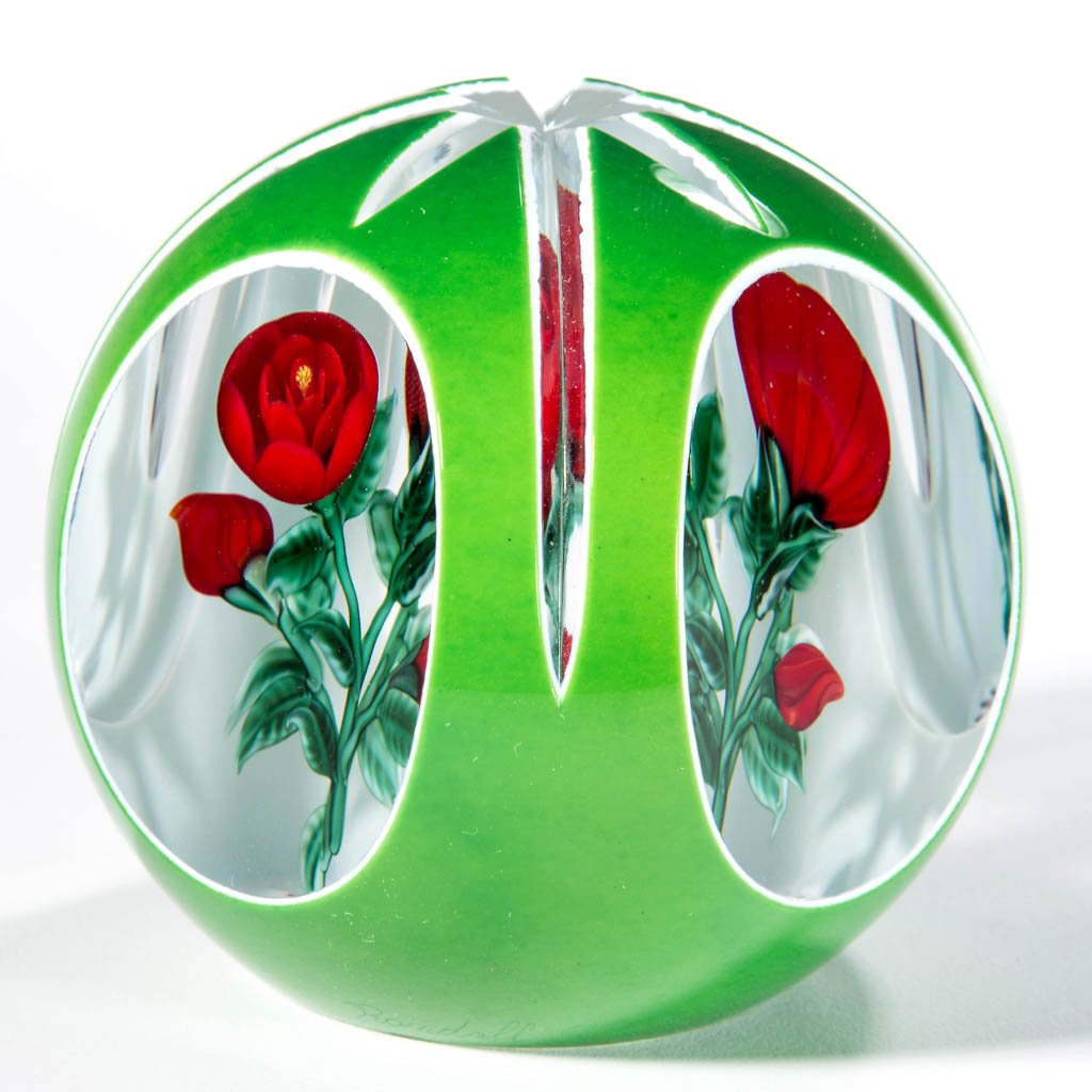 RANDALL GRUBB STUDIO ART GLASS LAMPWORK PAPERWEIGHT: RANDALL GRUBB STUDIO ART GLASS LAMPWORK PAPERWEIGHT, depicting red roses with white and green overlay, signed, "Randall Grubb, '88, 2/35." 1988. 3" DOA. Provenance: From a private collection.
