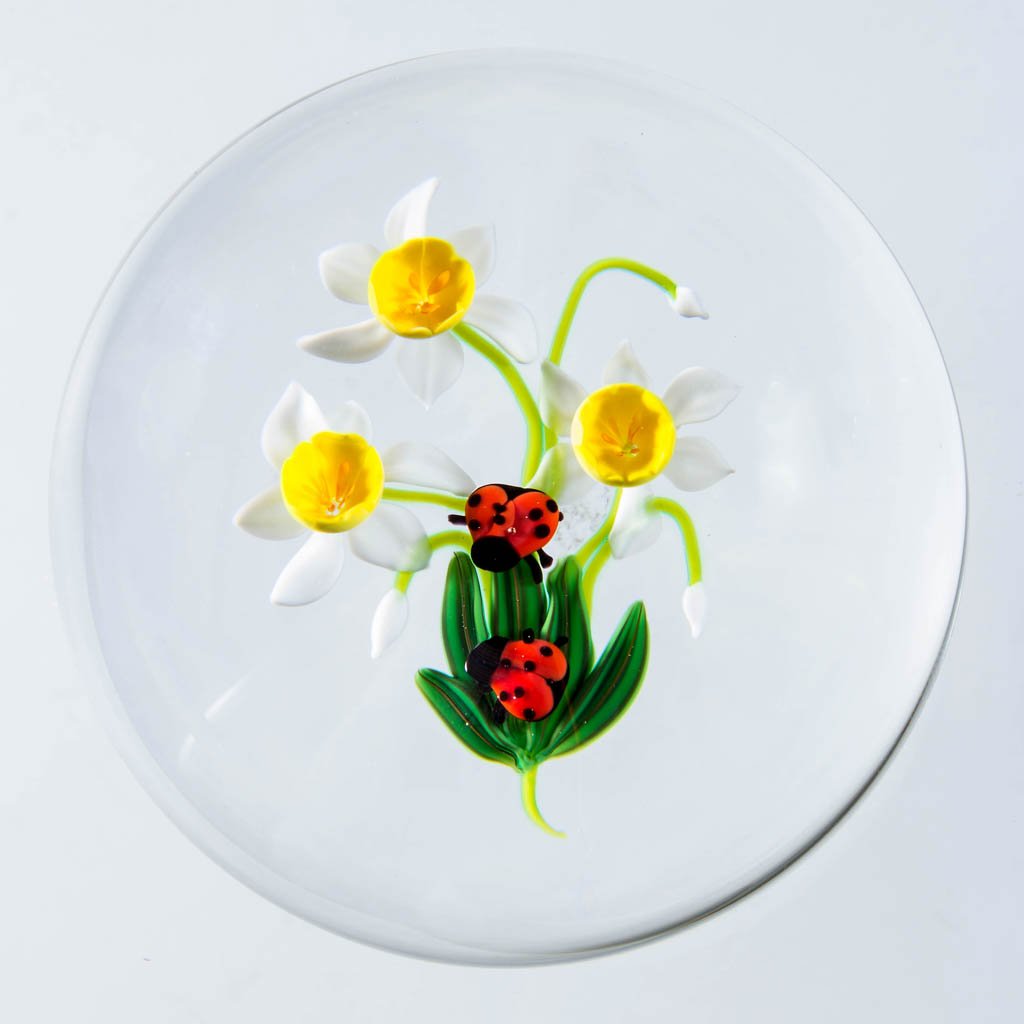 KEN ROSENFELD STUDIO ART GLASS LAMPWORK PAPERWEIGHT: KEN ROSENFELD STUDIO ART GLASS LAMPWORK PAPERWEIGHT, depicting jonquils and ladybugs, signed and dated, signature "R" cane visible. 1997. 3 1/4" D. Provenance: From a private collection.