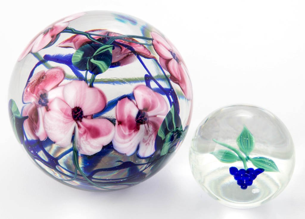 ASSORTED STUDIO ART GLASS PAPERWEIGHTS, LOT OF TWO: ASSORTED STUDIO ART GLASS PAPERWEIGHTS, LOT OF TWO, comprising a Hugh Smith blue berries, and a Richard Alma floral weight. Second half 20th century. Floral 3 3/4" D. Provenance: From a private collec