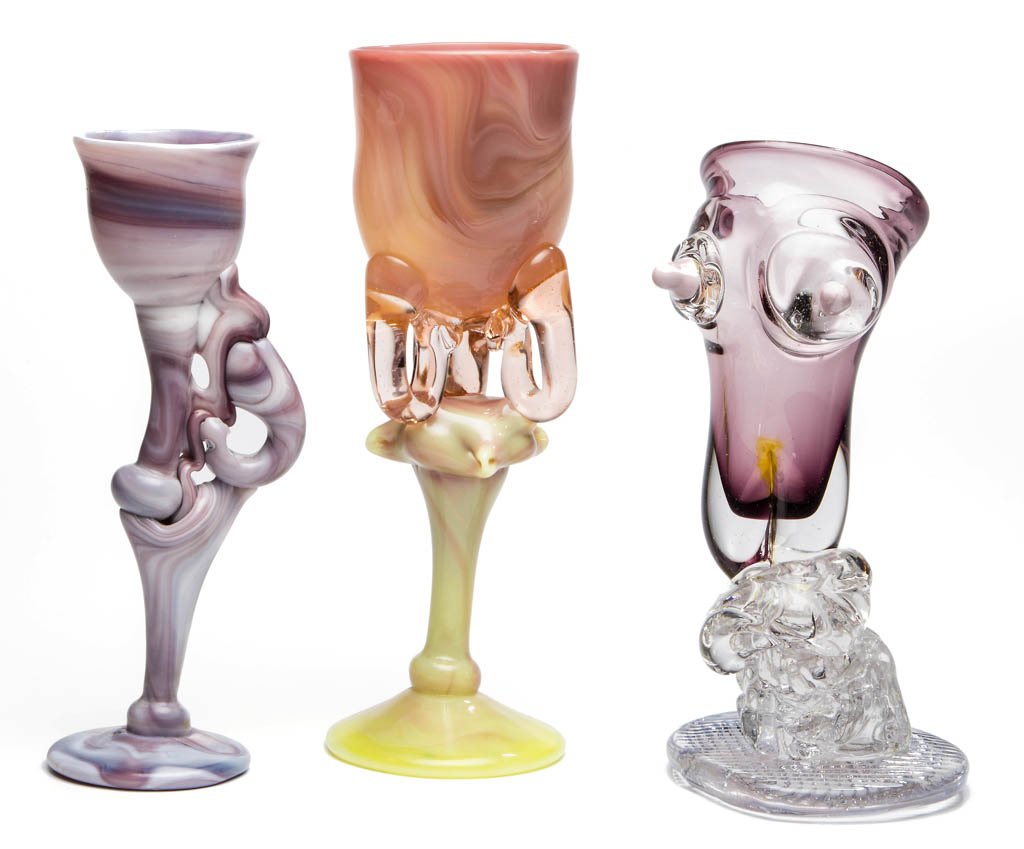 ASSORTED STUDIO ART GLASS CHALICES, LOT OF THREE: ASSORTED STUDIO ART GLASS CHALICES, LOT OF THREE, various colors, including a Jerry Hovanec figural chalice. 1982-1988. 9 3/8" to 10 3/4" HOA. Provenance: From the collection of the late Gail Britton.