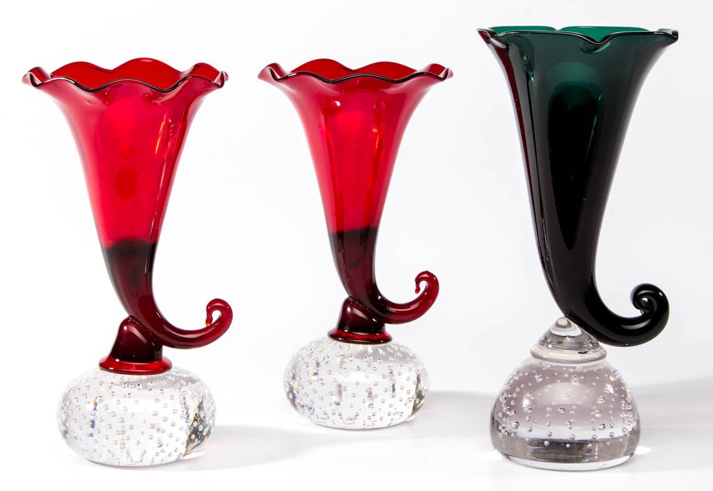 PAIRPOINT CORNUCOPIA VASES, PAIR: PAIRPOINT CORNUCOPIA VASES, PAIR, colorless and ruby, each with a scalloped rim on a controlled-bubble base. Together with a green cornucopia vase of unknown origin, with a polished rim, possibly by f