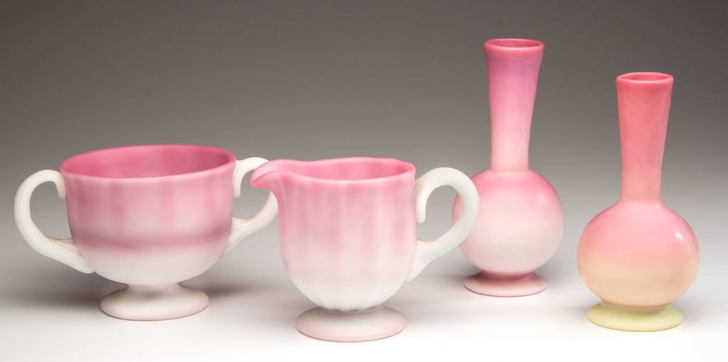 PAIRPOINT PEACHBLOW AND BURMESE ARTICLES, LOT OF FOUR: PAIRPOINT PEACHBLOW AND BURMESE ARTICLES, LOT OF FOUR, plush finish, comprising a Gunderson peachblow cream and sugar set, and two bulb vases, one peachblow and the other being Burmese. Gunderson-Pair