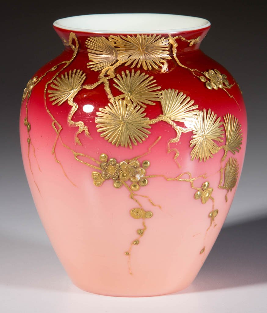 WEBB CASED PEACHBLOW VASE: WEBB CASED PEACHBLOW VASE, deep rose to pink, urn form with Jules Barbe gilt enameled decoration, polished pontil mark. Thomas Webb & Sons. Fourth quarter 19th century. 4 1/2" H. Literature: Parallels