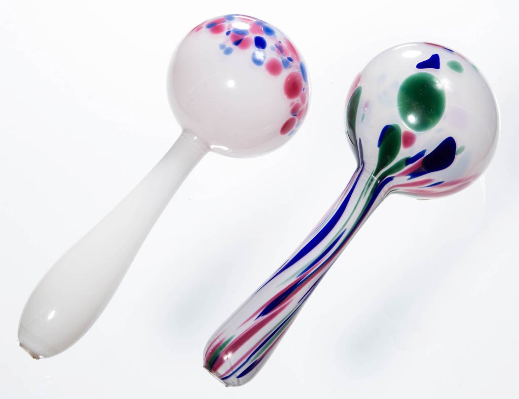 FREE-BLOWN MOTTLED GLASS DARNING BALLS, LOT OF TWO: FREE-BLOWN MOTTLED GLASS DARNING BALLS, LOT OF TWO, opal-cased colorless with blue, green, and rose, handles with rough open-pontil ends. Boston & Sandwich Glass Co. and others. 1840-1880. Example wit