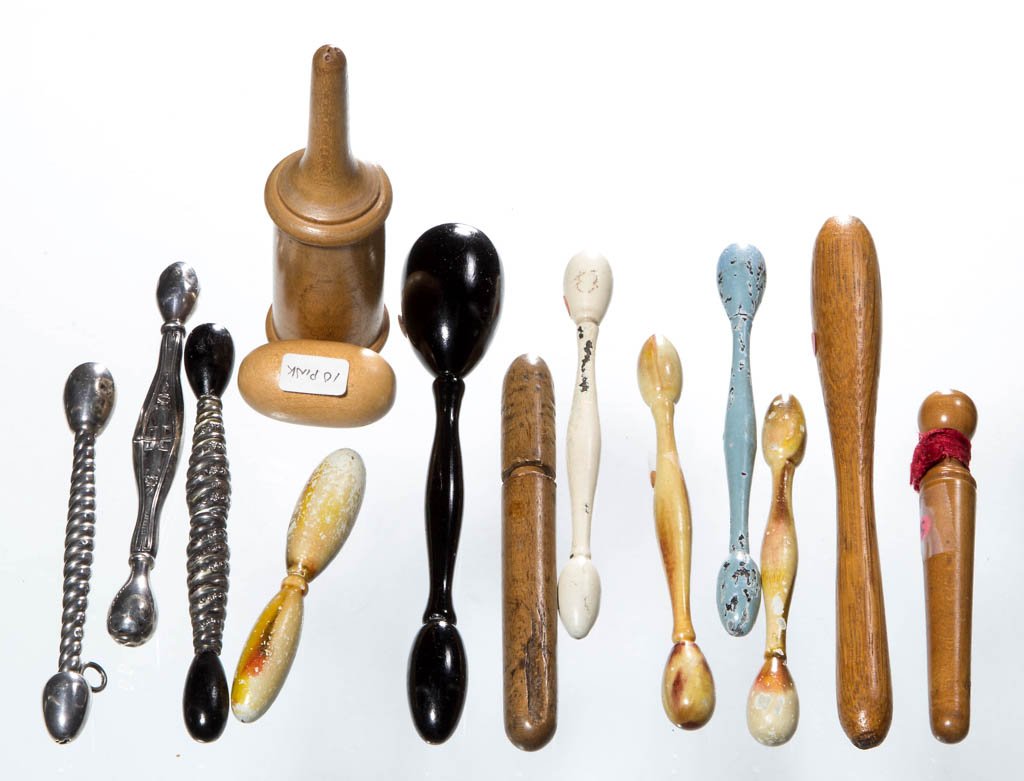 ASSORTED WOOD AND STERLING SILVER GLOVE DARNERS, LOT OF: ASSORTED WOOD AND STERLING SILVER GLOVE DARNERS, LOT OF 14, comprising eleven various woods, several with enamel decoration; and three sterling comprising two Webster Co. examples, one with black ebon