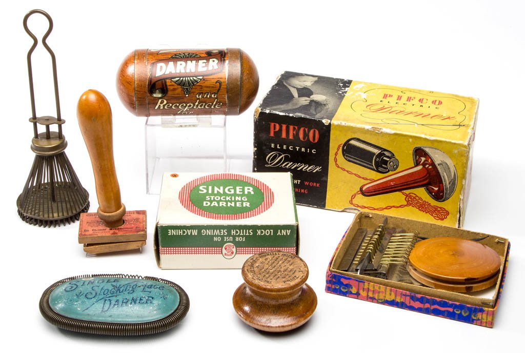ASSORTED LABELED DARNERS / DARNING RELATED ARTICLES,: ASSORTED LABELED DARNERS / DARNING RELATED ARTICLES, LOT OF EIGHT, comprising a Singer Sewing Machine Co. stocking darner in original box, a PIFCO Electric Darner in original box, a "Speedweve" mechan