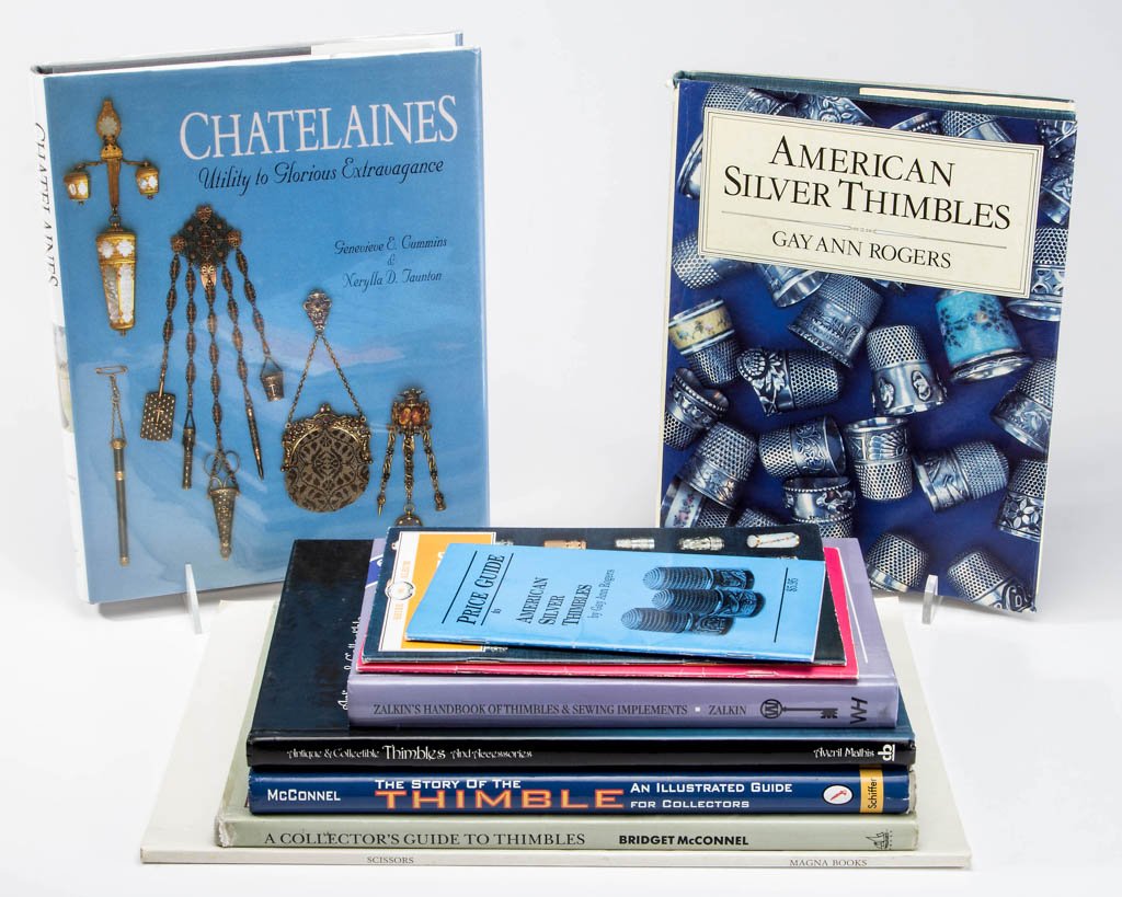 ASSORTED SEWING REFERENCE VOLUMES, LOT OF TEN: ASSORTED SEWING REFERENCE VOLUMES, LOT OF TEN, including Mathis, "Antique & Collectible Thimbles and Accessories" author-signed with inscription, Cummins-Taunton, "Chatelaines: Utility to Glorious Ext