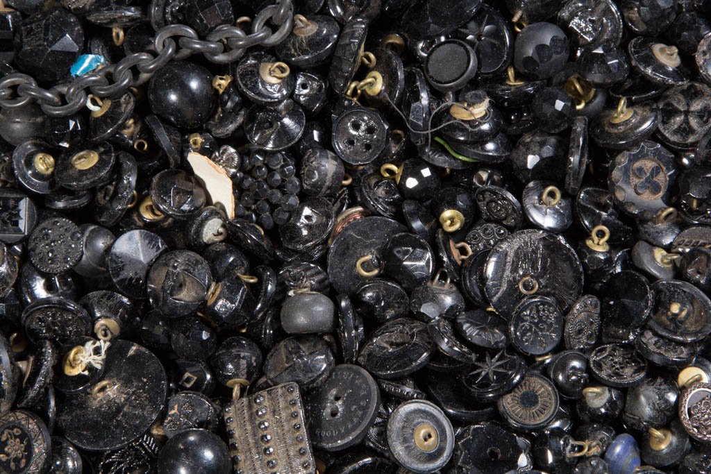 VINTAGE BLACK / JET BUTTONS: VINTAGE BLACK / JET BUTTONS, uncounted lot, most with molded decorations. 19th and 20th century. Various sizes. Provenance: From a private Pennsylvania collection.
