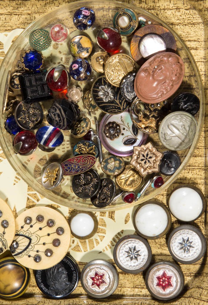 VINTAGE BUTTONS: VINTAGE BUTTONS, uncounted lot, including mottled and plain glass, celluloid and marcasite, mother-of-pearl, figural face, etc. 19th and 20th century. Various sizes. Provenance: From a private Pennsyl