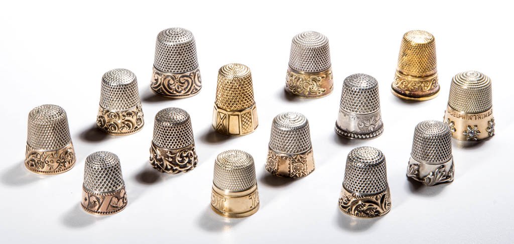 ASSORTED STERLING SILVER THIMBLES, LOT OF 14: ASSORTED STERLING SILVER THIMBLES, LOT OF 14, various patterns including floral and scroll bands, comprising four Simons Brothers examples, including Louis XV heavy scroll rim and another marked "PHIL