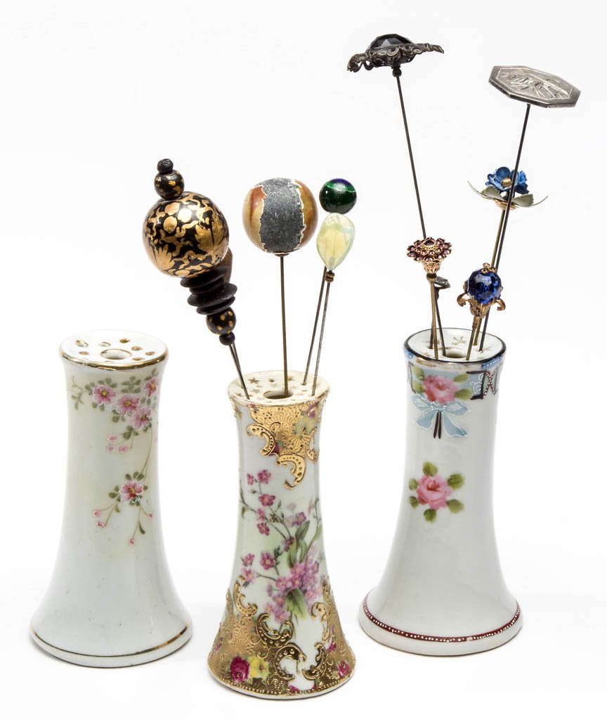 NIPPON CHINA HATPIN HOLDERS, LOT OF THREE: NIPPON CHINA HATPIN HOLDERS, LOT OF THREE, including a marked SNB example with gilt decoration, remainder unmarked. Together with assorted hatpins and related articles. First half 20th century. Holder