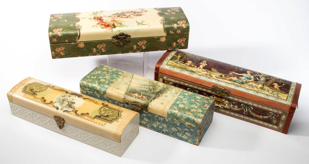 VICTORIAN CELLULOID GLOVE BOXES, LOT OF FOUR: VICTORIAN CELLULOID GLOVE BOXES, LOT OF FOUR, two depicting figures and two with landscapes, each with original clasp and interior fabric lining. Late 19th/early 20th century. 12" to 13 1/2" L. Proven