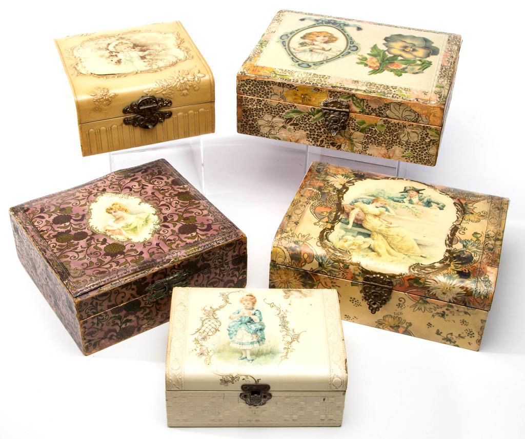 VICTORIAN CELLULOID DRESSER BOXES, LOT OF FIVE: VICTORIAN CELLULOID DRESSER BOXES, LOT OF FIVE, each depicting a figure, with original clasp and interior fabric lining. Late 19th/early 20th century. 5 1/4" to 8" L. Provenance: Nadene J. Stockard Es