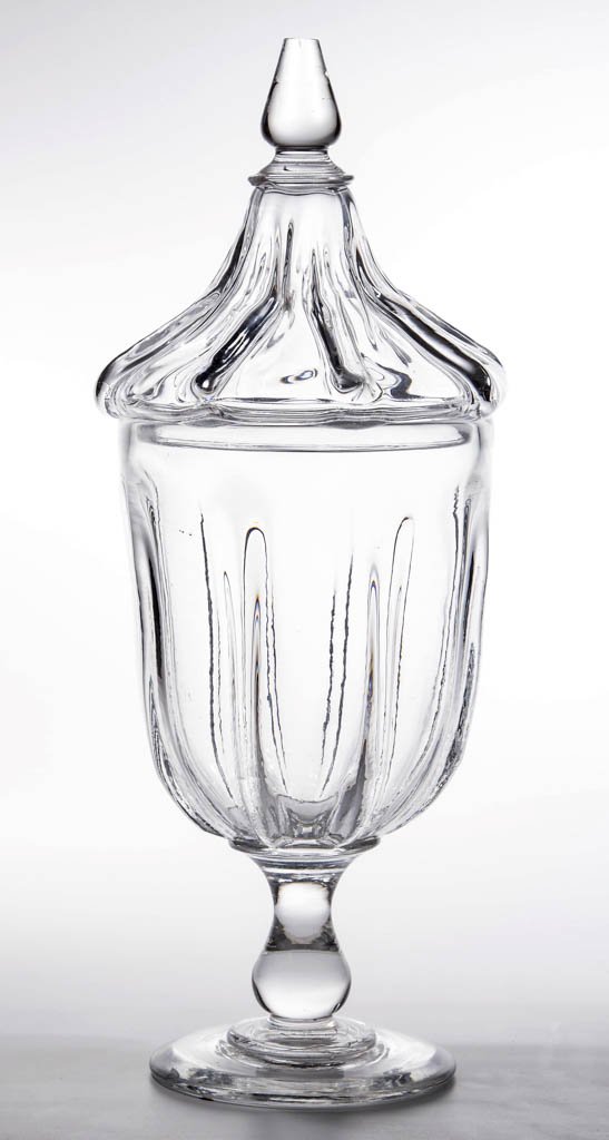 PILLAR-MOLDED URN-FORM APOTHECARY OR SHOW JAR WITH: PILLAR-MOLDED URN-FORM APOTHECARY OR SHOW JAR WITH COVER, colorless, deep bowl with eight ribs and a plain rim, raised on an applied baluster-form stem and circular foot with a polished pontil mark, h