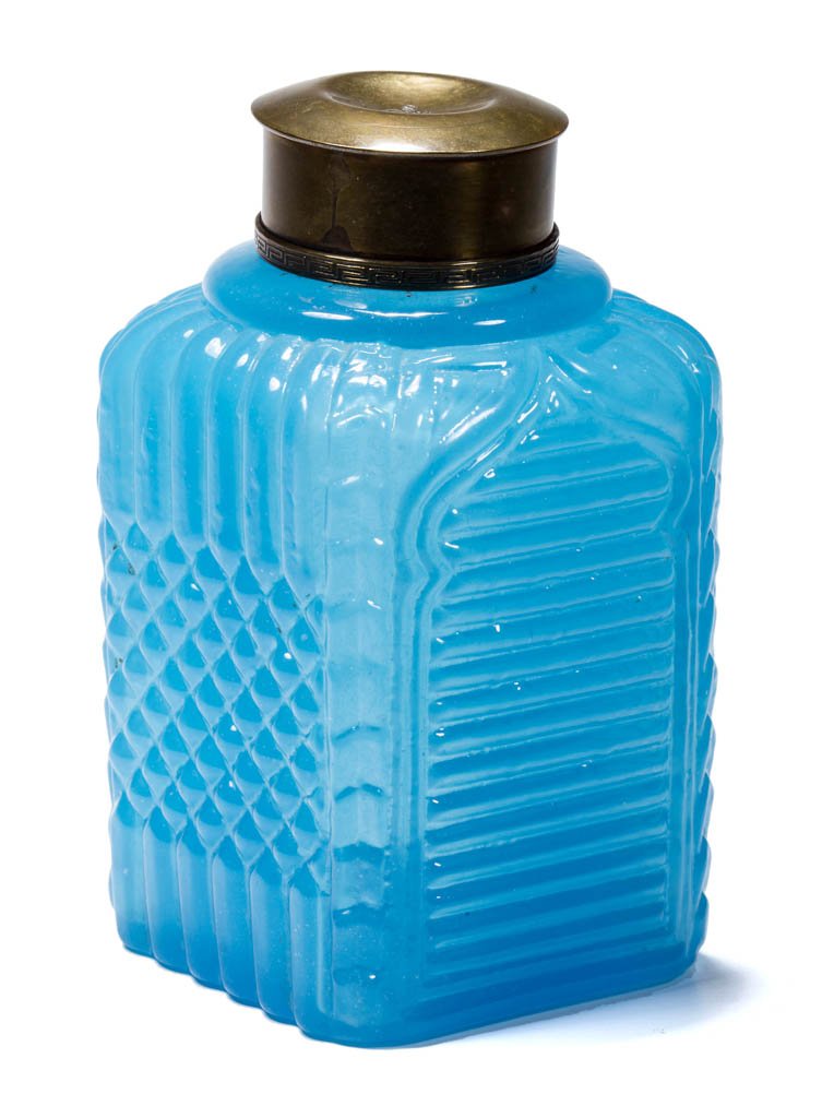 BLOWN-MOLDED SNUFF JAR: BLOWN-MOLDED SNUFF JAR, translucent starch blue, square form with alternating horizontal ribbed gothic arch and vertical rib and diaper diamond panels, brass mount and cap, light pontil mark under bas