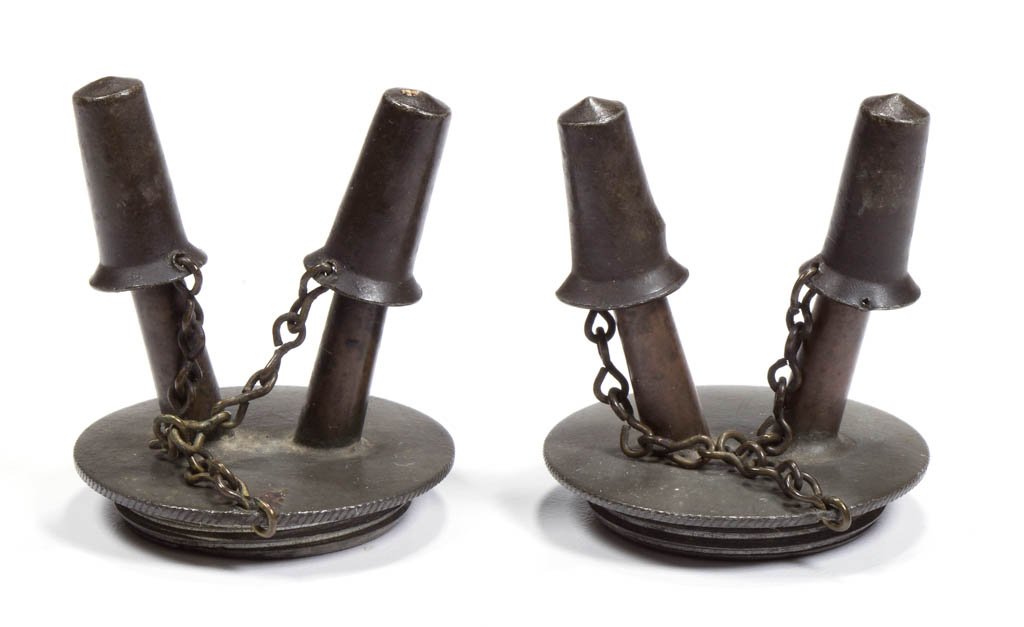 PEWTER AND BRASS DOUBLE-TUBE FLUID BURNERS, PAIR: PEWTER AND BRASS DOUBLE-TUBE FLUID BURNERS, PAIR, each with a coin edge, original chains and caps. Circa 1840-1860. 1 3/4" HOA, 1 3/16" D threads. Provenance: Property of Art & Kathy Green.