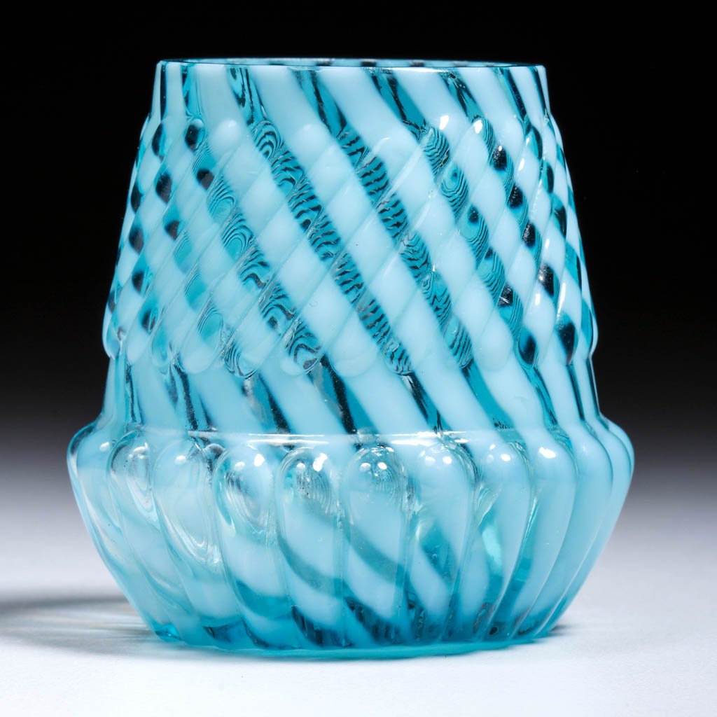 CHRYSANTHEMUM SWIRL TOOTHPICK HOLDER: CHRYSANTHEMUM SWIRL TOOTHPICK HOLDER, blue opalescent, factory polished rim. Northwood Glass Co./Dugan Glass Co. Circa 1893. 2 1/8" H. Literature: Bredehoft/Sanford - Glass Toothpick Holders, p. 160,