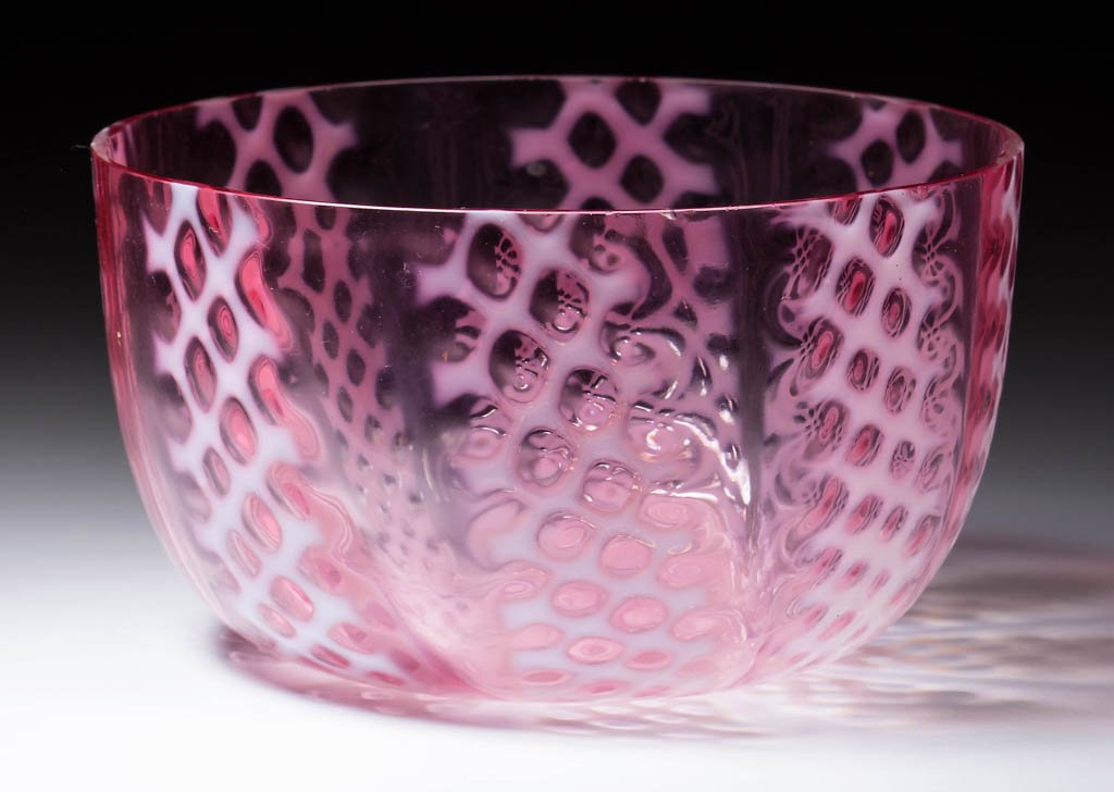 CRISS-CROSS BOWL: CRISS-CROSS BOWL, cranberry opalescent, factory polished rim. Consolidated Lamp & Glass Co. Circa 1888. 2 5/8" H, 4 5/8" D. Literature: Parallels Heacock/Elmore - Opalescent Glass From A-Z, p. 163. Pr