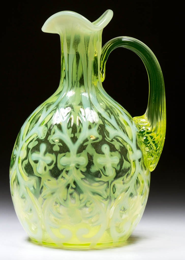 OPALINE BROCADE / SPANISH LACE CRUET: OPALINE BROCADE / SPANISH LACE CRUET, vaseline (uranium) opalescent, applied vaseline reeded handle, lacking stopper. Northwood Glass Co. Circa 1899. 5 3/4" HOA. Literature: Parallels Heacock/Elmore -