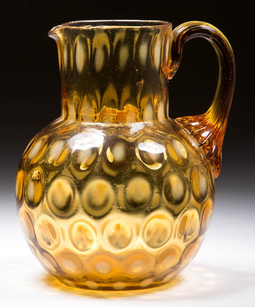 PHOENIX SPOT-OPTIC PITCHER: PHOENIX SPOT-OPTIC PITCHER, amber opalescent, ball form, circular rim, applied amber reeded handle, polished pontil mark. Phoenix Glass Co. Circa 1883-1888. 4 1/2" H. Literature: Marple - Phoenix Art