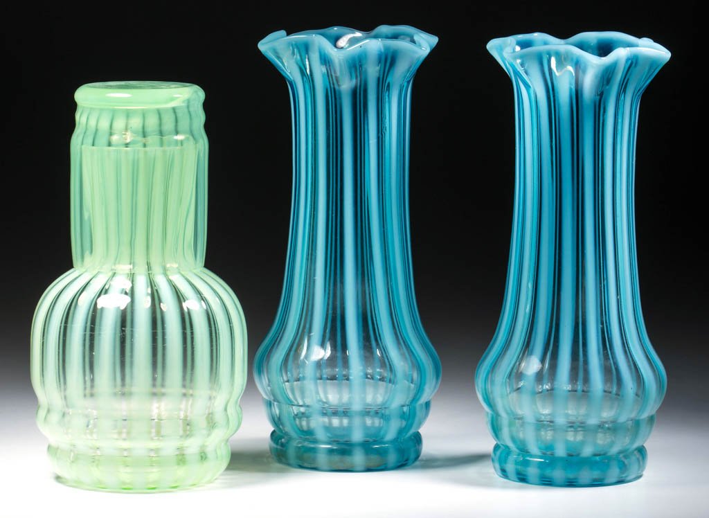 RIB OPTIC ARTICLES, LOT OF THREE: RIB OPTIC ARTICLES, LOT OF THREE, blue and pale green opalescent, comprising a Fenton tumble-up and two vases, tumbler with a factory polished rim. Fenton Art Glass Co. First half 20th century. 6 3/4"