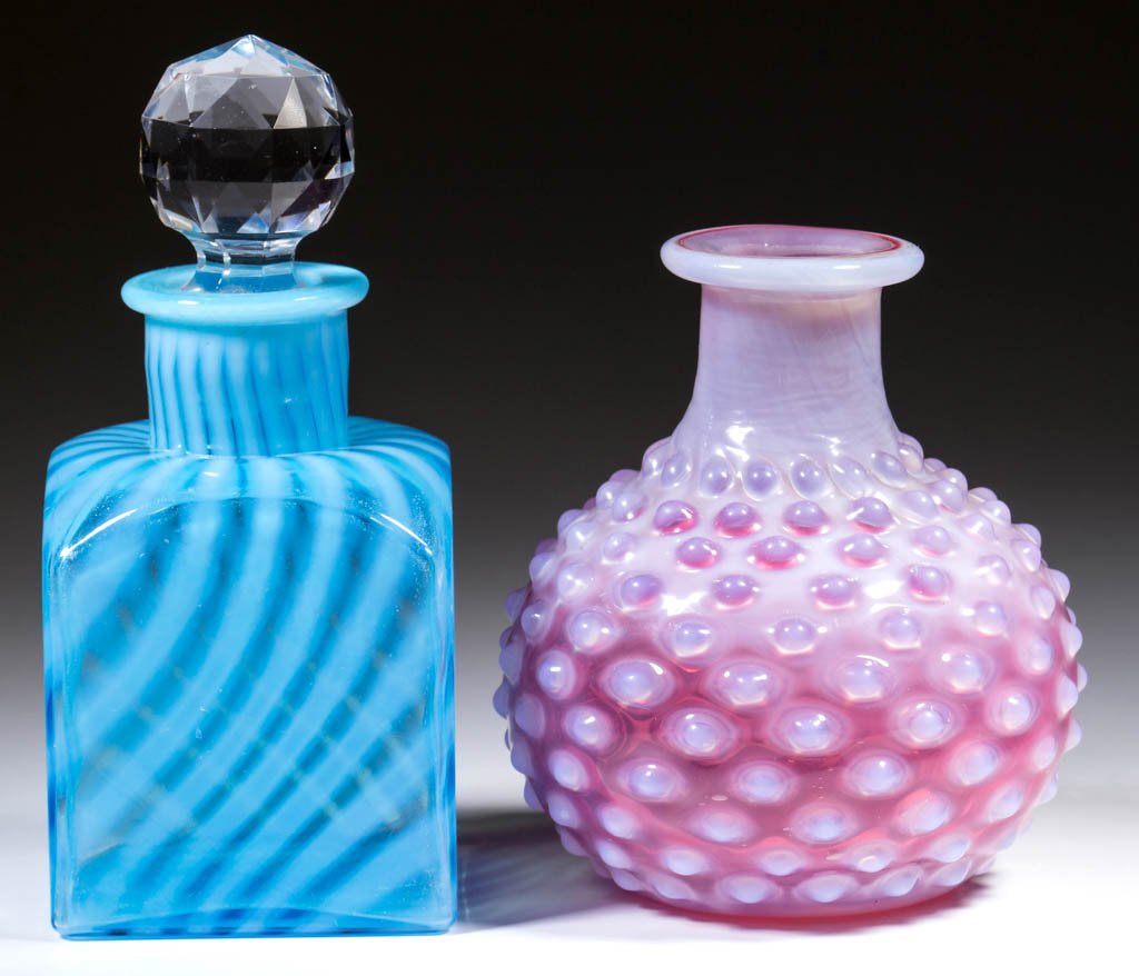 VICTORIAN OPALESCENT COLOGNES, LOT OF TWO: VICTORIAN OPALESCENT COLOGNES, LOT OF TWO, comprising a blue opalescent Swirl square-form example with cut-faceted stopper, etched "8," to the extension; and a cranberry opalescent Hobnail globular-fo