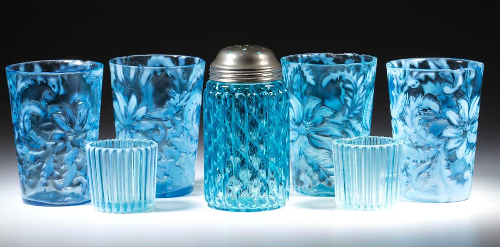 ASSORTED VICTORIAN OPALESCENT GLASS ARTICLES, LOT OF: ASSORTED VICTORIAN OPALESCENT GLASS ARTICLES, LOT OF SEVEN, blue opalescent, comprising four Poinsettia tumblers, two Beatty Rib toothpick holders, and a Ribbed Lattice sugar shaker. H. Northwood Co.
