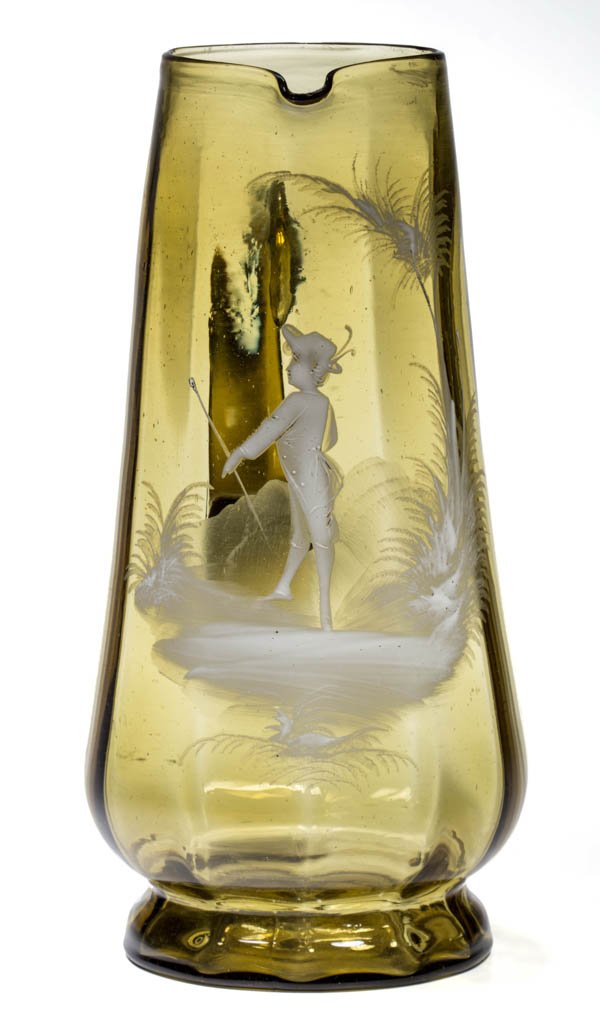 VICTORIAN PANEL-OPTIC WATER PITCHER: VICTORIAN PANEL-OPTIC WATER PITCHER, amber, tapered tankard form with so-called Mary Gregory white-enamel decoration of a boy with walking stick, rough pontil mark. Late 19th/early 20th century. 10" H